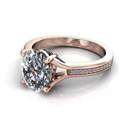 Isla oval classic solitaire engagement ring in 14K Rose Gold, three-quarter perspective showing the oval center on claw prongs above a channel-set pav&eacute; split shank