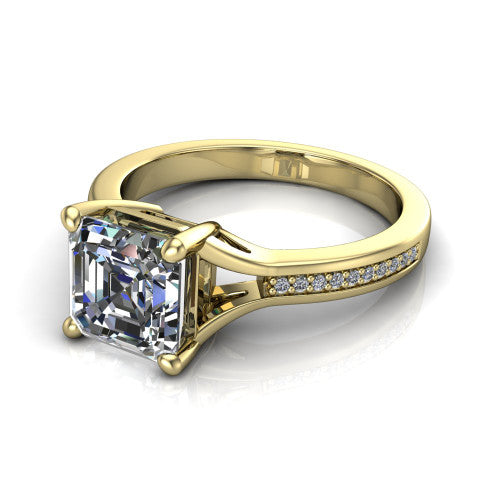 Isla square emerald classic solitaire engagement ring in 14K Yellow Gold, three-quarter perspective showing the square emerald center on claw prongs above a channel-set pav&eacute; split shank