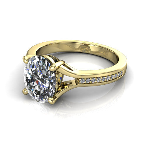 Isla oval classic solitaire engagement ring in 14K Yellow Gold, three-quarter perspective showing the oval center on claw prongs above a channel-set pav&eacute; split shank