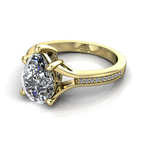 Isla pear classic solitaire engagement ring in 18K Yellow Gold, three-quarter perspective showing the pear center on claw prongs above a channel-set pav&eacute; split shank