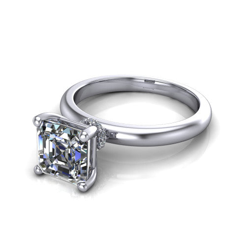 Delilah square emerald hidden halo engagement ring in Platinum, three-quarter perspective showing the square emerald center on claw prongs above a plain band with a hidden pav&eacute; halo