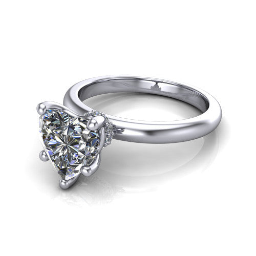 Delilah heart hidden halo engagement ring in 18K White Gold, three-quarter perspective showing the heart center on claw prongs above a plain band with a hidden pav&eacute; halo