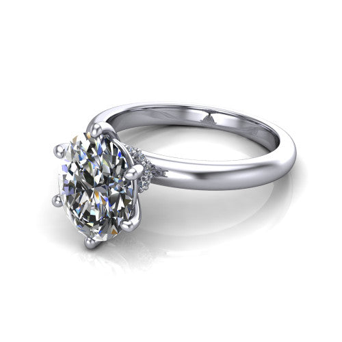 Delilah oval hidden halo engagement ring in 18K White Gold, three-quarter perspective showing the oval center on claw prongs above a plain band with a hidden pav&eacute; halo