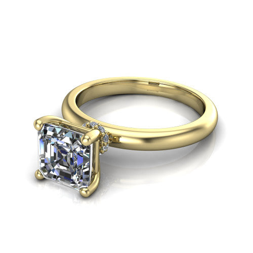 Delilah square emerald hidden halo engagement ring in 18K Yellow Gold, three-quarter perspective showing the square emerald center on claw prongs above a plain band with a hidden pav&eacute; halo