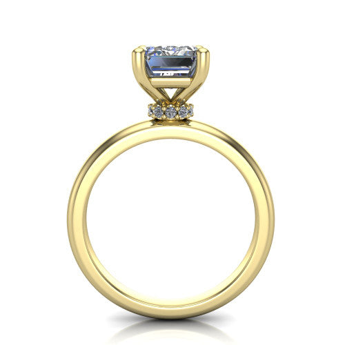 Delilah emerald hidden halo engagement ring in 14K Yellow Gold, through-finger front profile showing the hidden pav&eacute; halo beneath the emerald center