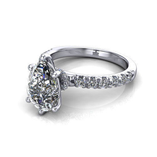 Gabriella pear hidden halo engagement ring in Platinum, three-quarter perspective showing the pear center on claw prongs above a pav&eacute; band with a hidden halo
