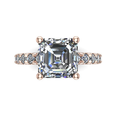 Gabriella emerald hidden halo engagement ring in 18K Rose Gold, top-down view showing the emerald center and the pav&eacute; diamond shoulders