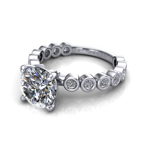 Kinsley round solitaire engagement ring in Platinum with bezel-set diamond accent band, three-quarter perspective view