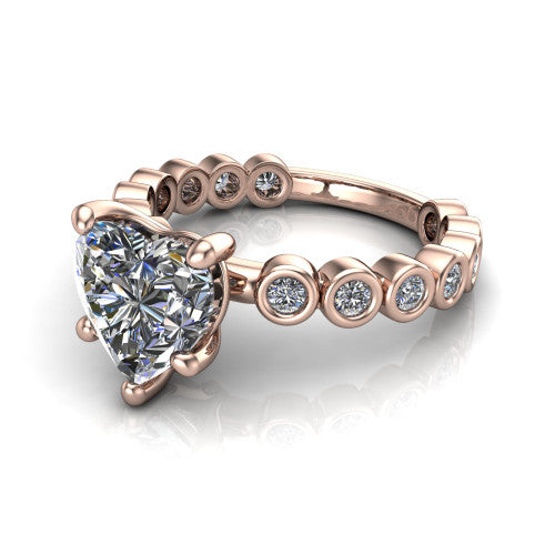 Kinsley heart solitaire engagement ring in 14K Rose Gold with bezel-set diamond accent band, three-quarter perspective view