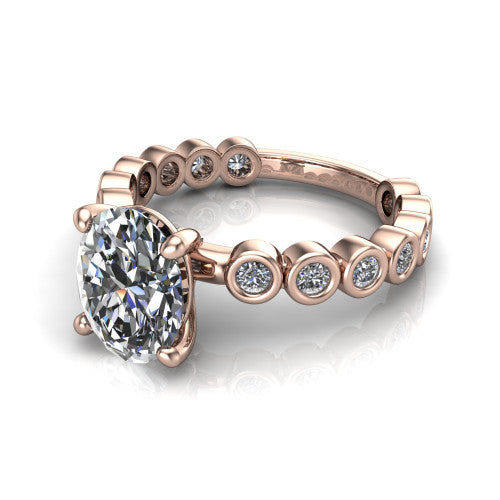 Kinsley oval solitaire engagement ring in 14K Rose Gold with bezel-set diamond accent band, three-quarter perspective view