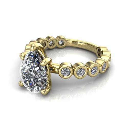 Kinsley pear solitaire engagement ring in 14K Yellow Gold with bezel-set diamond accent band, three-quarter perspective view