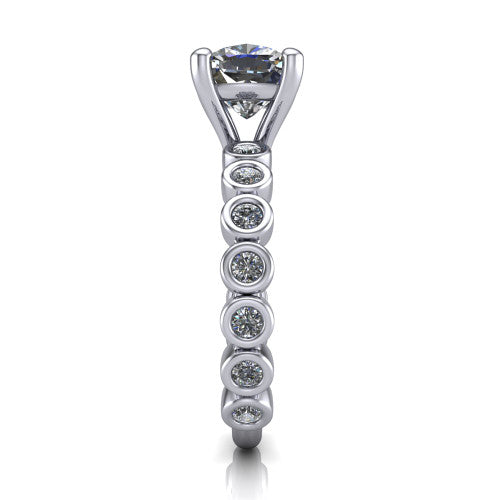 Kinsley cushion solitaire engagement ring in Platinum with bezel-set diamond accent band, side profile showing the bezel-set diamond shank