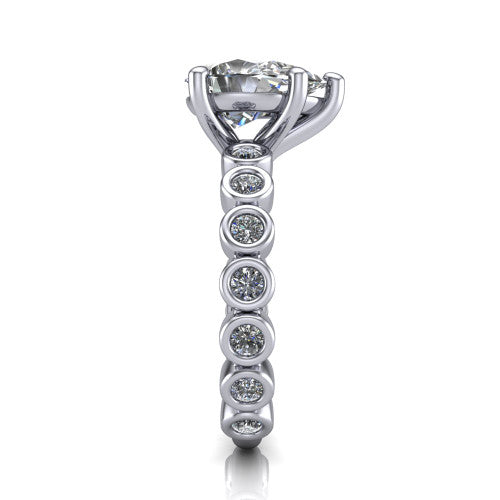 Kinsley pear solitaire engagement ring in 14K White Gold with bezel-set diamond accent band, side profile showing the bezel-set diamond shank