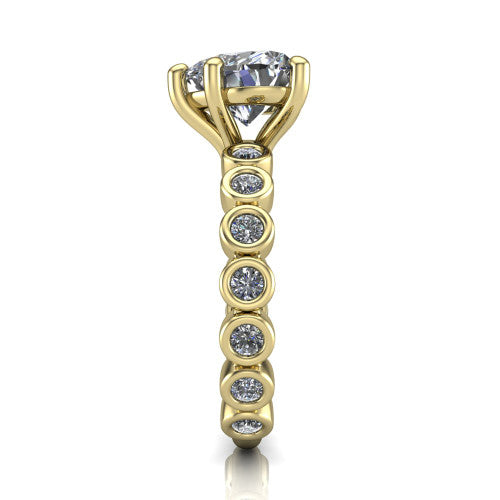 Kinsley heart solitaire engagement ring in 18K Yellow Gold with bezel-set diamond accent band, side profile showing the bezel-set diamond shank
