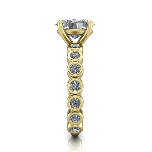 Kinsley oval solitaire engagement ring in 18K Yellow Gold with bezel-set diamond accent band, side profile showing the bezel-set diamond shank