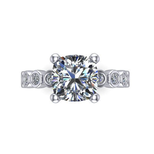 Kinsley cushion solitaire engagement ring in Platinum with bezel-set diamond accent band, top-down view of the center stone and bezel band