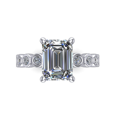 Kinsley emerald solitaire engagement ring in Platinum with bezel-set diamond accent band, top-down view of the center stone and bezel band