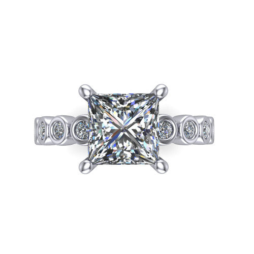 Kinsley princess solitaire engagement ring in 14K White Gold with bezel-set diamond accent band, top-down view of the center stone and bezel band