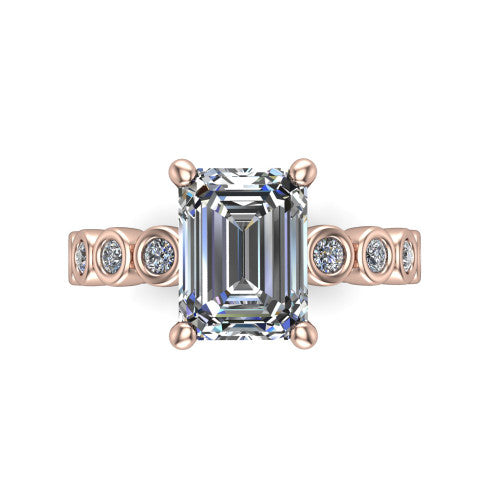 Kinsley emerald solitaire engagement ring in 18K Rose Gold with bezel-set diamond accent band, top-down view of the center stone and bezel band