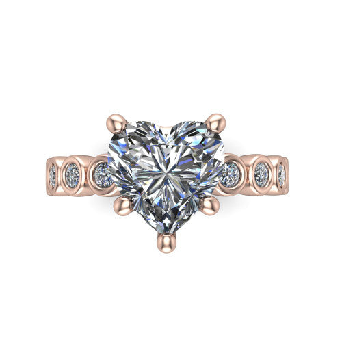 Kinsley heart solitaire engagement ring in 14K Rose Gold with bezel-set diamond accent band, top-down view of the center stone and bezel band
