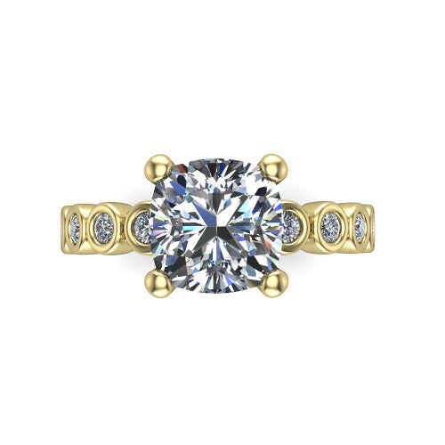 Kinsley cushion solitaire engagement ring in 14K Yellow Gold with bezel-set diamond accent band, top-down view of the center stone and bezel band