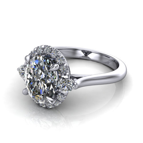 Riley oval halo engagement ring in Platinum with squared pavé halo and round side accents, three-quarter perspective view