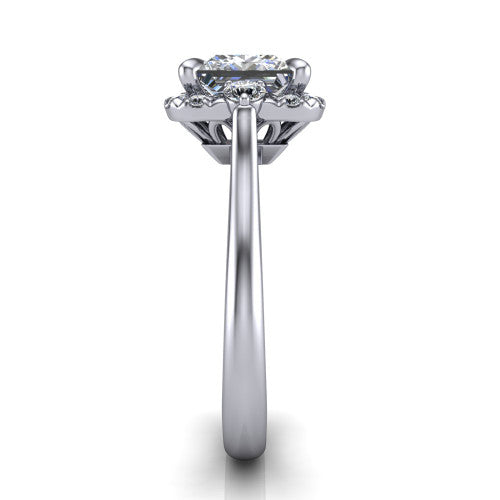 Riley princess halo engagement ring in 18K White Gold with squared pavé halo and round side accents, side profile showing the plain cathedral band and openwork gallery