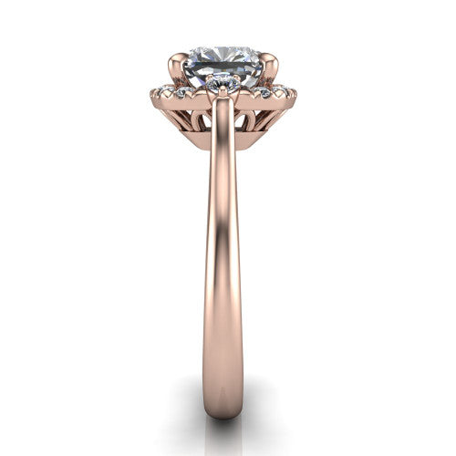 Riley cushion halo engagement ring in 18K Rose Gold with squared pavé halo and round side accents, side profile showing the plain cathedral band and openwork gallery