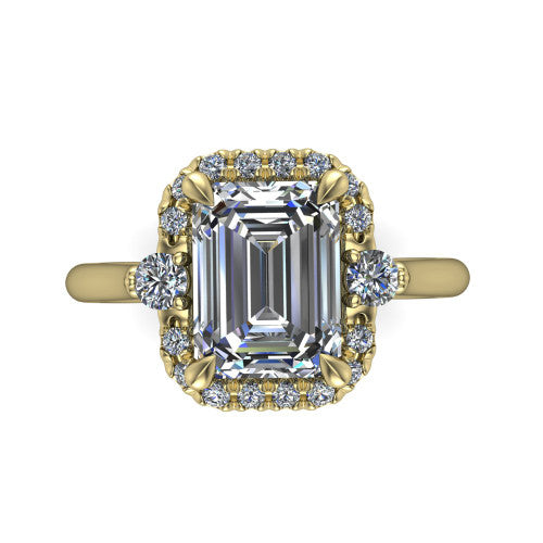 Riley emerald halo engagement ring in 18K Yellow Gold with squared pavé halo and round side accents, top-down view of the squared halo and round side accents