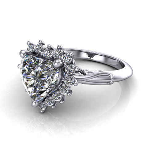 Serenity heart halo engagement ring in Platinum, three-quarter perspective showing the heart center diamond in a floral cluster halo with filigree shoulders