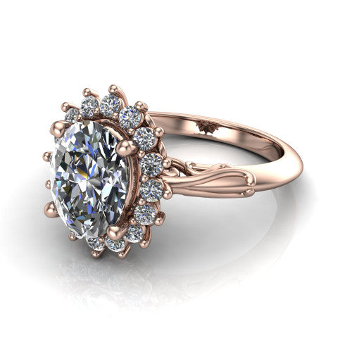 Serenity oval halo engagement ring in 14K Rose Gold, three-quarter perspective showing the oval center diamond in a floral cluster halo with filigree shoulders