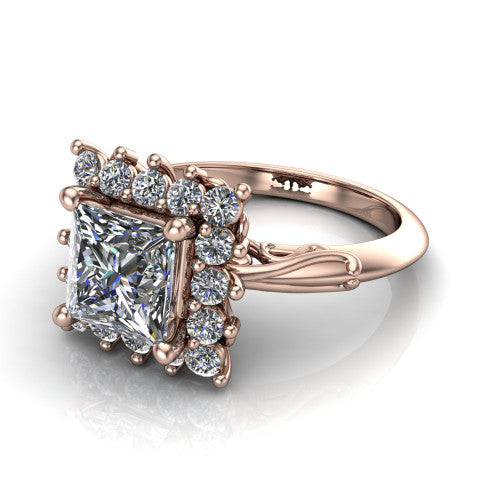 Serenity princess halo engagement ring in 18K Rose Gold, three-quarter perspective showing the princess center diamond in a floral cluster halo with filigree shoulders