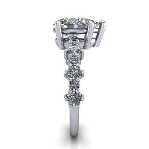 Leah pear classic engagement ring in Platinum with baguette and cluster accent band, side profile showing the cluster and baguette accent band