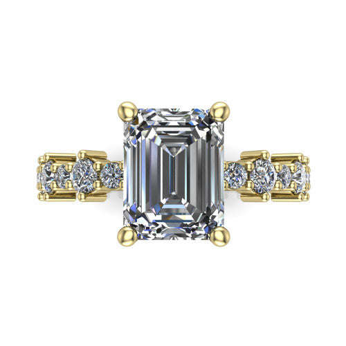 Leah emerald classic engagement ring in 14K Yellow Gold with baguette and cluster accent band, top-down view of the center stone and baguette accents