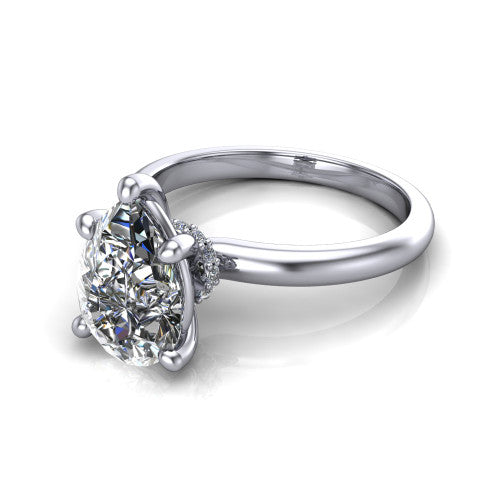 Quinn pear solitaire engagement ring in Platinum with hidden halo and plain band, three-quarter perspective view