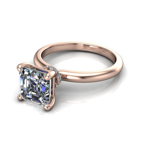 Quinn emerald solitaire engagement ring in 14K Rose Gold with hidden halo and plain band, three-quarter perspective view