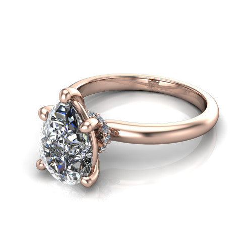 Quinn pear solitaire engagement ring in 18K Rose Gold with hidden halo and plain band, three-quarter perspective view