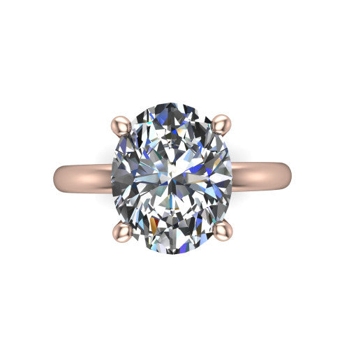 Quinn oval solitaire engagement ring in 18K Rose Gold with hidden halo and plain band, top-down view of the four-prong center and plain band