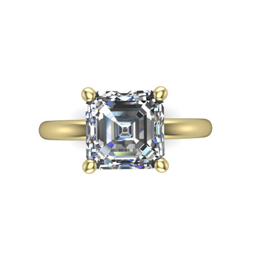 Quinn emerald solitaire engagement ring in 14K Yellow Gold with hidden halo and plain band, top-down view of the four-prong center and plain band