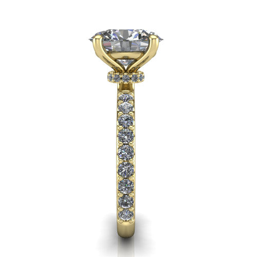 Clara oval pavé engagement ring in 18K Yellow Gold with hidden halo and micro-pavé band, side profile showing the hidden halo and pavé band