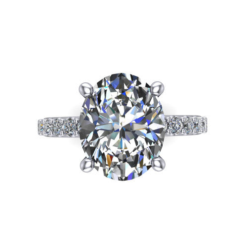 Clara oval pavé engagement ring in 18K White Gold with hidden halo and micro-pavé band, top-down view of the four-prong center and pavé band