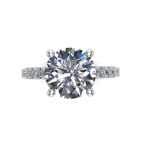 Clara round pavé engagement ring in Platinum with hidden halo and micro-pavé band, top-down view of the four-prong center and pavé band