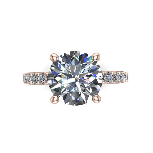 Clara round pavé engagement ring in 18K Rose Gold with hidden halo and micro-pavé band, top-down view of the four-prong center and pavé band
