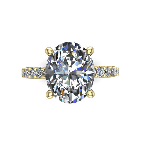 Clara oval pavé engagement ring in 18K Yellow Gold with hidden halo and micro-pavé band, top-down view of the four-prong center and pavé band