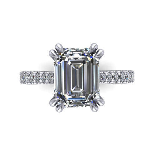 Paisley emerald solitaire engagement ring in Platinum with double-prong head and pavé band, top-down view of the double-prong head and pavé band