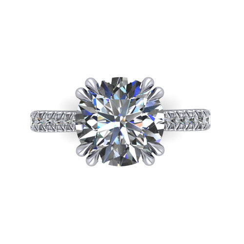 Paisley round solitaire engagement ring in 18K White Gold with double-prong head and pavé band, top-down view of the double-prong head and pavé band
