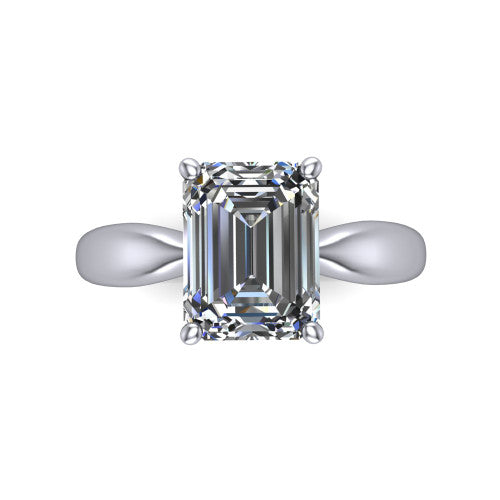 Natalie emerald solitaire engagement ring in 18K White Gold on a tapered plain band, top-down view of the four-prong head and crossover gallery
