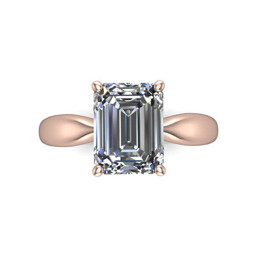 Natalie emerald solitaire engagement ring in 14K Rose Gold on a tapered plain band, top-down view of the four-prong head and crossover gallery