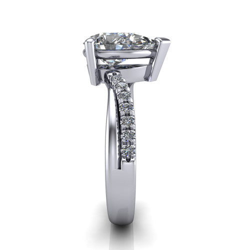Everly pear solitaire engagement ring in Platinum with micro-pavé band, side profile showing the crossover pavé band and open under-gallery