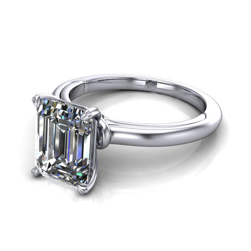 Leilani emerald solitaire engagement ring in 18K White Gold with double-prong head on a plain band, three-quarter perspective view